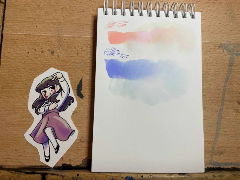 picture of two swatches of peach and lavender colored inks (incidentally called 'sakura' and 'nadeshiko)
